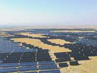 A drone is capturing images of photovoltaic power stations on both sides of the Beijing-Wei Expressway in Zhangjiakou, Hebei Province, China...