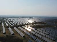 A drone is capturing images of photovoltaic power stations on both sides of the Beijing-Wei Expressway in Zhangjiakou, Hebei Province, China...