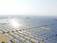 A drone is capturing images of photovoltaic power stations on both sides of the Beijing-Wei Expressway in Zhangjiakou, Hebei Province, China...