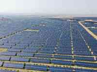 A drone is capturing images of photovoltaic power stations on both sides of the Beijing-Wei Expressway in Zhangjiakou, Hebei Province, China...