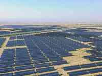 A drone is capturing images of photovoltaic power stations on both sides of the Beijing-Wei Expressway in Zhangjiakou, Hebei Province, China...