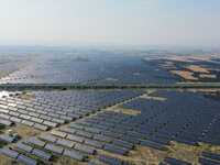 A drone is capturing images of photovoltaic power stations on both sides of the Beijing-Wei Expressway in Zhangjiakou, Hebei Province, China...