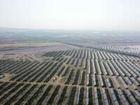 A drone is capturing images of photovoltaic power stations on both sides of the Beijing-Wei Expressway in Zhangjiakou, Hebei Province, China...