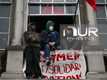 DUBLIN, IRELAND - MAY 4:
Trinity College Dublin windows occupied by students in Keffiyeh and face masks, waving Palestinian flags, on May 4,...