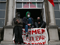 DUBLIN, IRELAND - MAY 4:
Trinity College Dublin windows occupied by students in Keffiyeh and face masks, waving Palestinian flags, on May 4,...