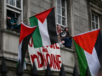 DUBLIN, IRELAND - MAY 4:
Trinity College Dublin windows occupied by students in Keffiyeh and face masks, waving Palestinian flags, on May 4,...