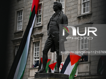 DUBLIN, IRELAND - MAY 4:
Trinity College Dublin windows occupied by students in Keffiyeh and face masks, waving Palestinian flags, on May 4,...