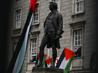 DUBLIN, IRELAND - MAY 4:
Trinity College Dublin windows occupied by students in Keffiyeh and face masks, waving Palestinian flags, on May 4,...