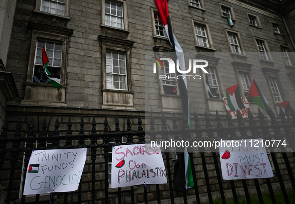 DUBLIN, IRELAND - MAY 4:
Trinity College Dublin windows occupied by students in Keffiyeh and face masks, waving Palestinian flags, on May 4,...