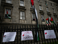 DUBLIN, IRELAND - MAY 4:
Trinity College Dublin windows occupied by students in Keffiyeh and face masks, waving Palestinian flags, on May 4,...