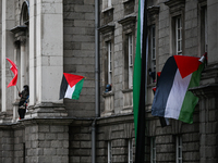 DUBLIN, IRELAND - MAY 4:
Trinity College Dublin windows occupied by students in Keffiyeh and face masks, waving Palestinian flags, on May 4,...