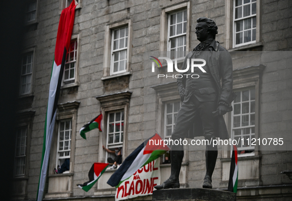 DUBLIN, IRELAND - MAY 4:
Trinity College Dublin windows occupied by students in Keffiyeh and face masks, waving Palestinian flags, on May 4,...