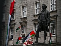 DUBLIN, IRELAND - MAY 4:
Trinity College Dublin windows occupied by students in Keffiyeh and face masks, waving Palestinian flags, on May 4,...