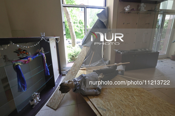 A mannequin is lying on the floor in a clothing shop that has been damaged by Russian shelling in Kharkiv, northeastern Ukraine, on May 5, 2...