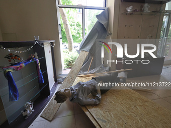 A mannequin is lying on the floor in a clothing shop that has been damaged by Russian shelling in Kharkiv, northeastern Ukraine, on May 5, 2...