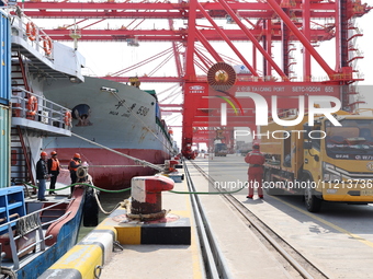 A worker is operating a machine at Taicang Port and the International Port to remove pollutants in Suzhou, Jiangsu Province, China, on March...