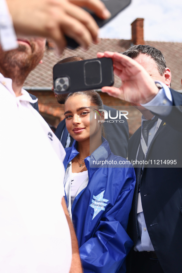 Participants take pictures with Noa Kirel, Israeli singer and actress, while attending the 36th anniversary of 'International March of the L...