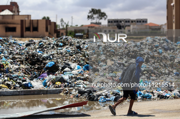 Piles of garbage are accumulating in Khan Yunis, in the southern Gaza Strip, amid the ongoing conflict between Israel and Hamas, on May 6, 2...