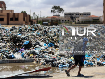 Piles of garbage are accumulating in Khan Yunis, in the southern Gaza Strip, amid the ongoing conflict between Israel and Hamas, on May 6, 2...