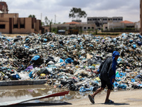 Piles of garbage are accumulating in Khan Yunis, in the southern Gaza Strip, amid the ongoing conflict between Israel and Hamas, on May 6, 2...