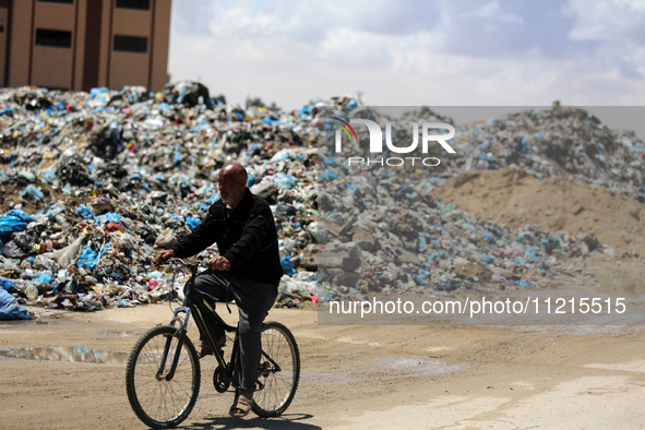 Piles of garbage are accumulating in Khan Yunis, in the southern Gaza Strip, amid the ongoing conflict between Israel and Hamas, on May 6, 2...