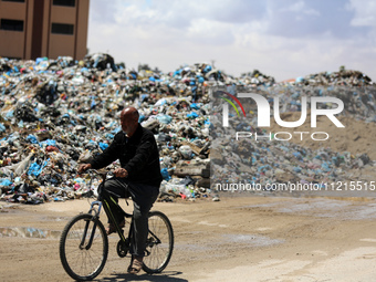 Piles of garbage are accumulating in Khan Yunis, in the southern Gaza Strip, amid the ongoing conflict between Israel and Hamas, on May 6, 2...