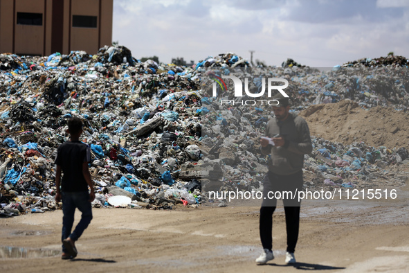 Piles of garbage are accumulating in Khan Yunis, in the southern Gaza Strip, amid the ongoing conflict between Israel and Hamas, on May 6, 2...