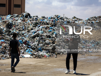 Piles of garbage are accumulating in Khan Yunis, in the southern Gaza Strip, amid the ongoing conflict between Israel and Hamas, on May 6, 2...