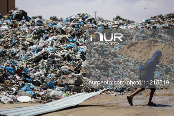 Piles of garbage are accumulating in Khan Yunis, in the southern Gaza Strip, amid the ongoing conflict between Israel and Hamas, on May 6, 2...