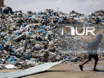 Piles of garbage are accumulating in Khan Yunis, in the southern Gaza Strip, amid the ongoing conflict between Israel and Hamas, on May 6, 2...