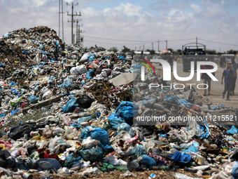 Piles of garbage are accumulating in Khan Yunis, in the southern Gaza Strip, amid the ongoing conflict between Israel and Hamas, on May 6, 2...