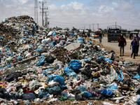 Piles of garbage are accumulating in Khan Yunis, in the southern Gaza Strip, amid the ongoing conflict between Israel and Hamas, on May 6, 2...