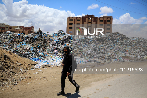 Piles of garbage are accumulating in Khan Yunis, in the southern Gaza Strip, amid the ongoing conflict between Israel and Hamas, on May 6, 2...