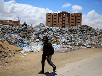 Piles of garbage are accumulating in Khan Yunis, in the southern Gaza Strip, amid the ongoing conflict between Israel and Hamas, on May 6, 2...