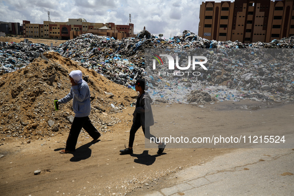 Piles of garbage are accumulating in Khan Yunis, in the southern Gaza Strip, amid the ongoing conflict between Israel and Hamas, on May 6, 2...