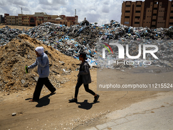 Piles of garbage are accumulating in Khan Yunis, in the southern Gaza Strip, amid the ongoing conflict between Israel and Hamas, on May 6, 2...