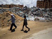 Piles of garbage are accumulating in Khan Yunis, in the southern Gaza Strip, amid the ongoing conflict between Israel and Hamas, on May 6, 2...