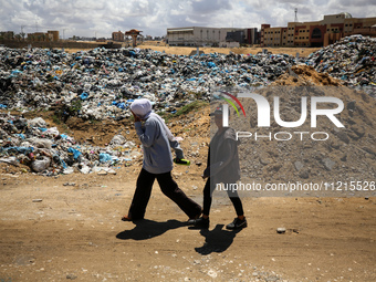 Piles of garbage are accumulating in Khan Yunis, in the southern Gaza Strip, amid the ongoing conflict between Israel and Hamas, on May 6, 2...