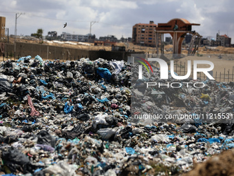 Piles of garbage are accumulating in Khan Yunis, in the southern Gaza Strip, amid the ongoing conflict between Israel and Hamas, on May 6, 2...