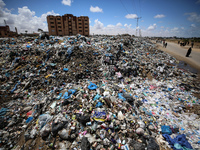 Piles of garbage are accumulating in Khan Yunis, in the southern Gaza Strip, amid the ongoing conflict between Israel and Hamas, on May 6, 2...