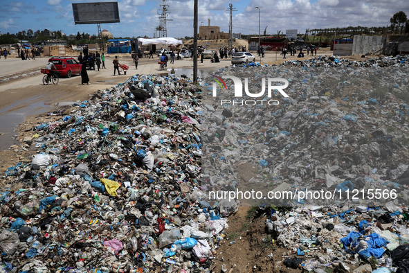 Piles of garbage are accumulating in Khan Yunis, in the southern Gaza Strip, amid the ongoing conflict between Israel and Hamas, on May 6, 2...