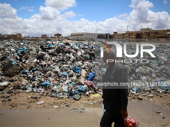 Piles of garbage are accumulating in Khan Yunis, in the southern Gaza Strip, amid the ongoing conflict between Israel and Hamas, on May 6, 2...