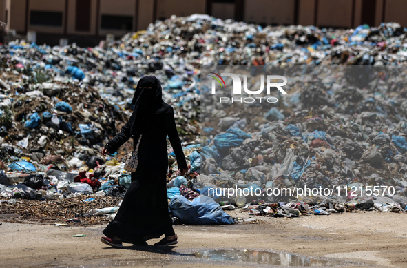 Piles of garbage are accumulating in Khan Yunis, in the southern Gaza Strip, amid the ongoing conflict between Israel and Hamas, on May 6, 2...