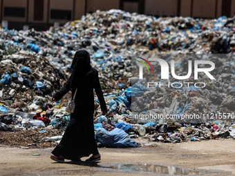 Piles of garbage are accumulating in Khan Yunis, in the southern Gaza Strip, amid the ongoing conflict between Israel and Hamas, on May 6, 2...