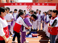 Volunteers from the Red Cross are explaining first aid at Xiyuan Middle School in Lianyungang, Jiangsu Province, East China, on May 8, 2024....