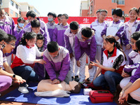 Volunteers from the Red Cross are explaining first aid at Xiyuan Middle School in Lianyungang, Jiangsu Province, East China, on May 8, 2024....