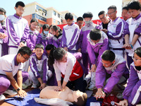 Volunteers from the Red Cross are explaining first aid at Xiyuan Middle School in Lianyungang, Jiangsu Province, East China, on May 8, 2024....