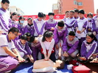 Volunteers from the Red Cross are explaining first aid at Xiyuan Middle School in Lianyungang, Jiangsu Province, East China, on May 8, 2024....