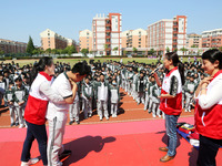 Volunteers from the Red Cross are explaining first aid at Xiyuan Middle School in Lianyungang, Jiangsu Province, East China, on May 8, 2024....