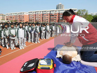 Volunteers from the Red Cross are explaining first aid at Xiyuan Middle School in Lianyungang, Jiangsu Province, East China, on May 8, 2024....